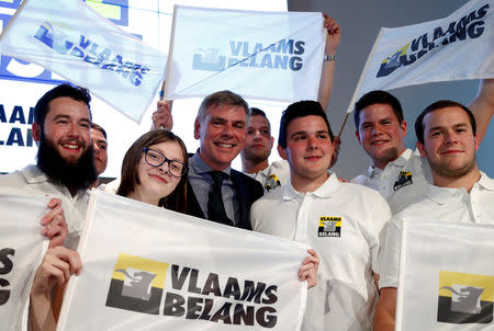 Member of the far-right Flemish separatist party Vlaams Belang Filip Dewinter poses with supporters during a party event after the Belgian general and regional elections and European Parliament elections in Londerzeel, Belgium, May 26, 2019. REUTERS/Francois Lenoir