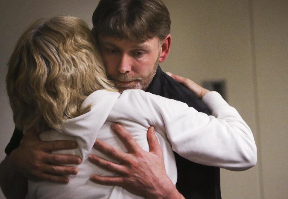 CORRECTS SPELLING OF HAILE - Jay Kifer, the father of Haile Kifer, gets a hug from his aunt Bonnie Czech, after Byron Smith was found guilty in the murders of Nick Brady, 17, and Kifer, 18, at the Morrison County Courthouse in Little Falls, Minn., Tuesday, April 29, 2014. Smith, a Minnesota homeowner shot and killed the teenagers during a 2012 Thanksgiving Day break-in, was convicted of premeditated murder. The jury took only about three hours to reject his claim of self-defense. He was immediately sentenced to life without parole. Smith was immediately sentenced to life without parole. (AP Photo/The Star Tribune, David Joles) MANDATORY CREDIT; ST. PAUL PIONEER PRESS OUT; MAGS OUT; TWIN CITIES TV OUT.