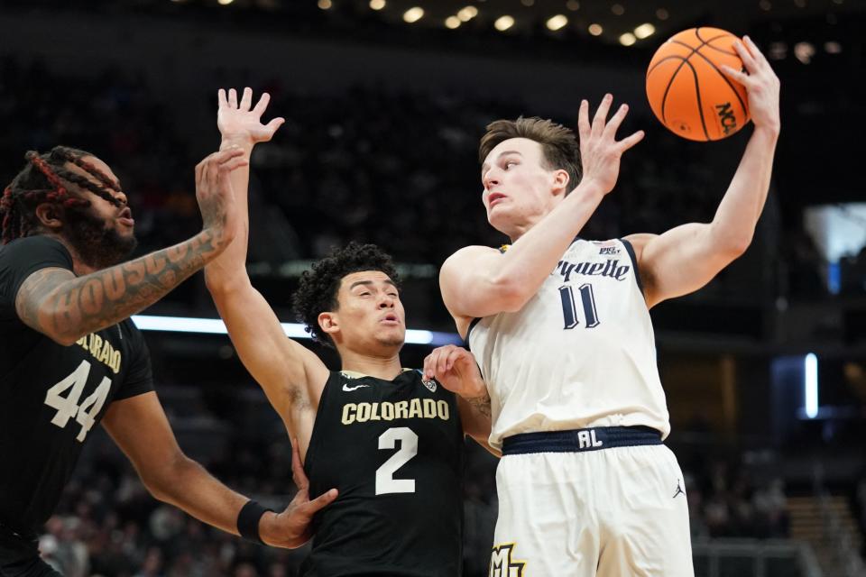Marquette's Tyler Kolek had 21 points, five rebounds and 11 assists in an 81-77 victory over the Colorado Buffaloes on Sunday.