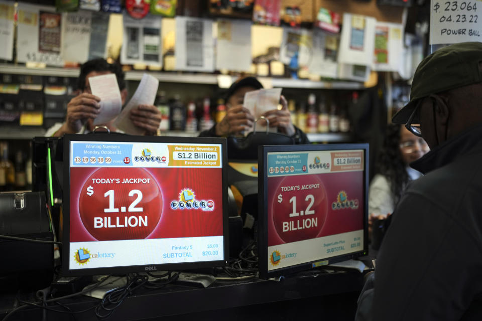 The Powerball jackpot amount is shown on displays at Bluebird Liquor in Hawthorne, Calif., Wednesday, Nov. 2, 2022. (AP Photo/Jae C. Hong)