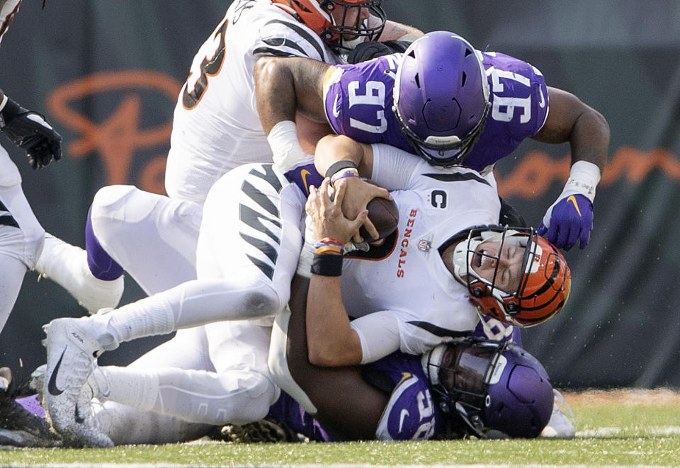 Minnesota Vikings defensive tackle Michael Pierce (58) sacks Cincinnati Bengals quarterback Joe Burrow in overtime of an NFL football game Sunday, Sept. 12, 2021, in Cincinnati. (Carlos Gonzalez/Star Tribune via AP)