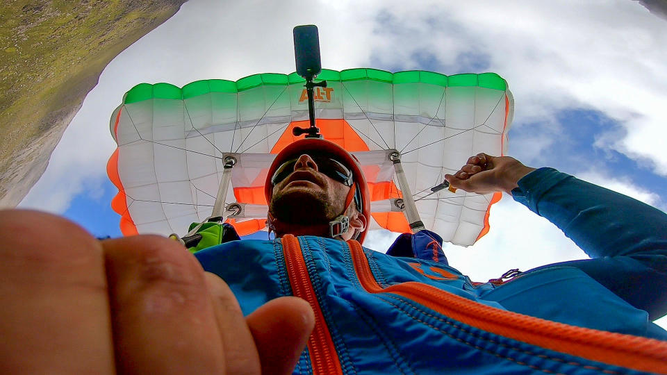 A brave base jumper has become the first person ever to fly a wingsuit from the top of a British mountain. Former Royal Marine Tim Howell, 31, leapt from the 4,000ft peak of An Teallach in the northwest Highlands in Scotland. He plunged down a steep gully for 30 seconds before deploying his parachute and landing safely on the banks of Loch Toll an Lochain.