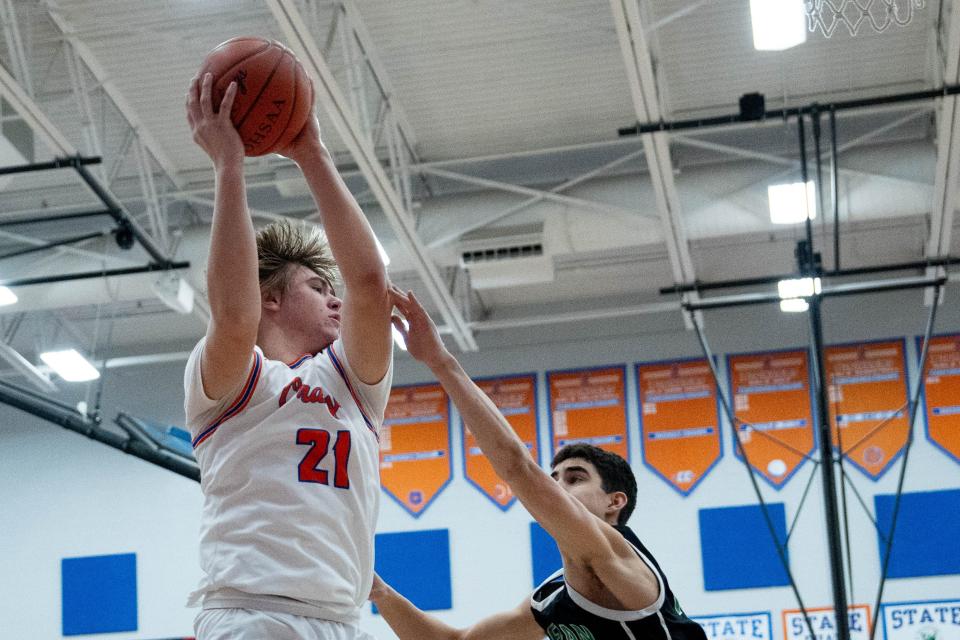 Olentangy Orange's Beckett Miller grabs a rebound against Dublin Coffman on Dec. 22.