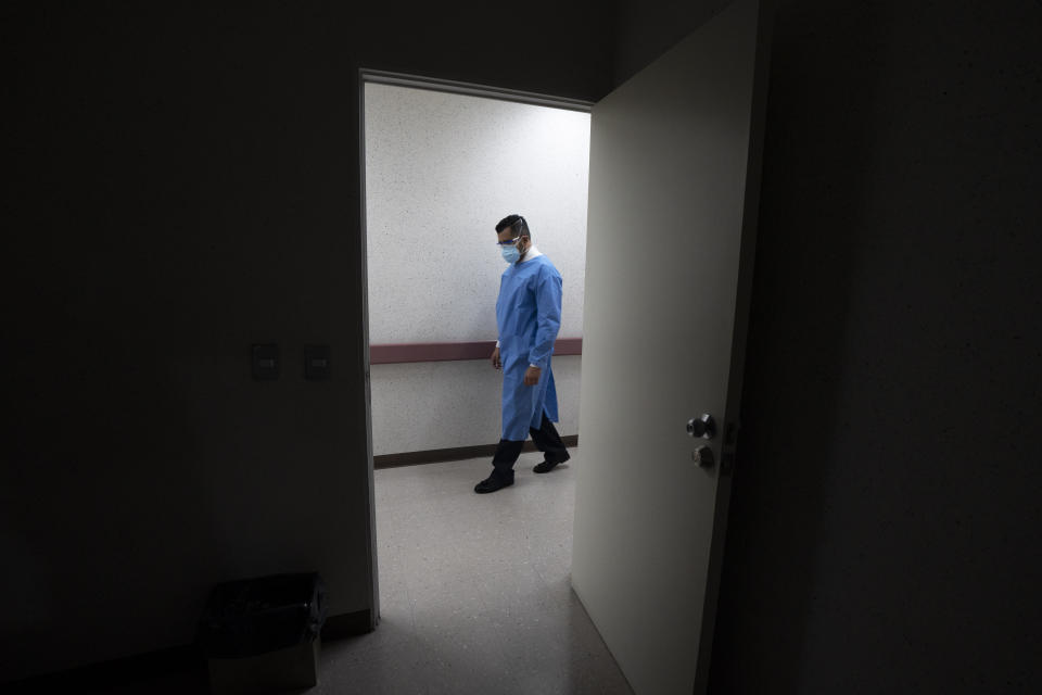 The director of the Ajusco Medio General Hospital which is designated for COVID-19 cases only, Dr. Jesus Ortiz, walks in the hallways of the hospital in Mexico City, Tuesday, Aug. 31, 2021. (AP Photo/Marco Ugarte)