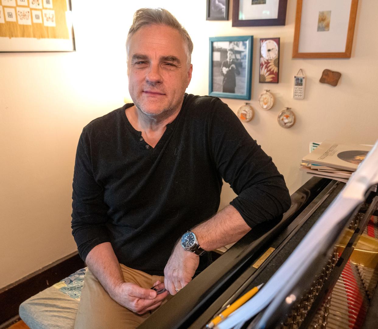 Indiana University Jacob School of Music Professor Brent Wallarab sits at his piano Monday, May 6, 2024 at his home. He explains the similarities and differences of the two songs, “On the Banks of the Wabash” and “Back Home Again in Indiana.”
