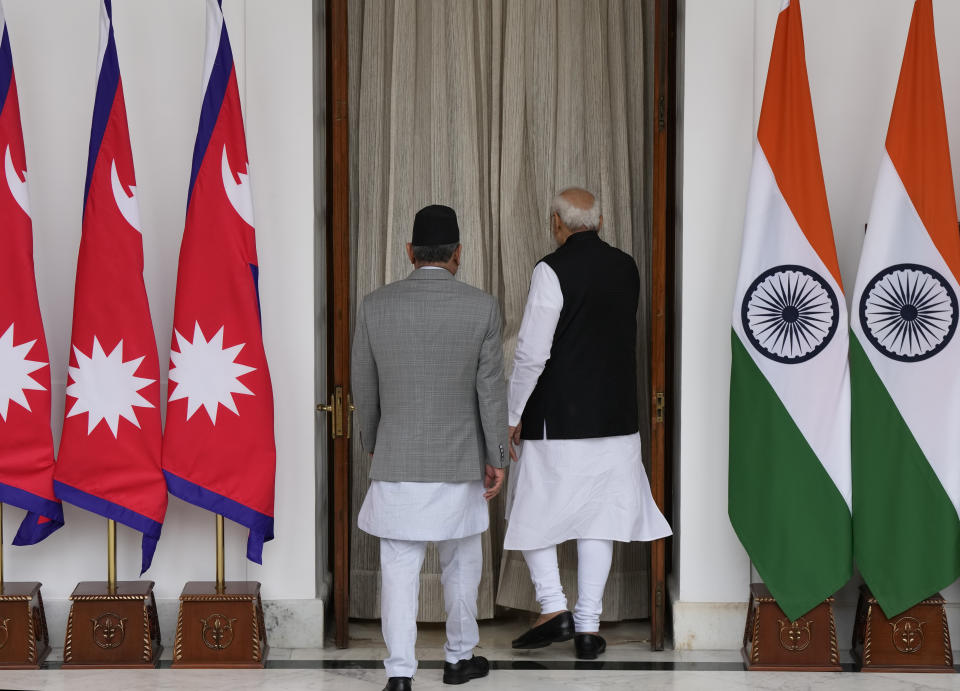 Nepal’s Prime Minister Pushpa Kamal Dahal and his Indian counterpart Narendra Modi, right, arrive for their meeting in New Delhi, India, Thursday, June 1, 2023. Dahal arrived Wednesday on a state visit, his first trip abroad since taking power in December last year. (AP Photo/Manish Swarup)