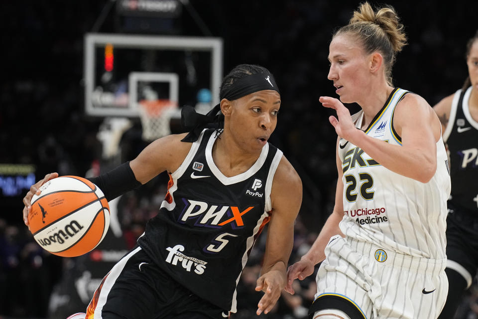 Phoenix Mercury guard Shey Peddy (5) drives on Chicago Sky guard Courtney Vandersloot during the first half of Game 2 of basketball's WNBA Finals, Wednesday, Oct. 13, 2021, in Phoenix. (AP Photo/Rick Scuteri)