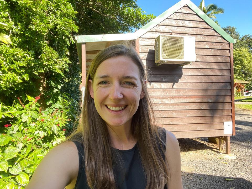 The author outside her tiny house at Paronella Park.