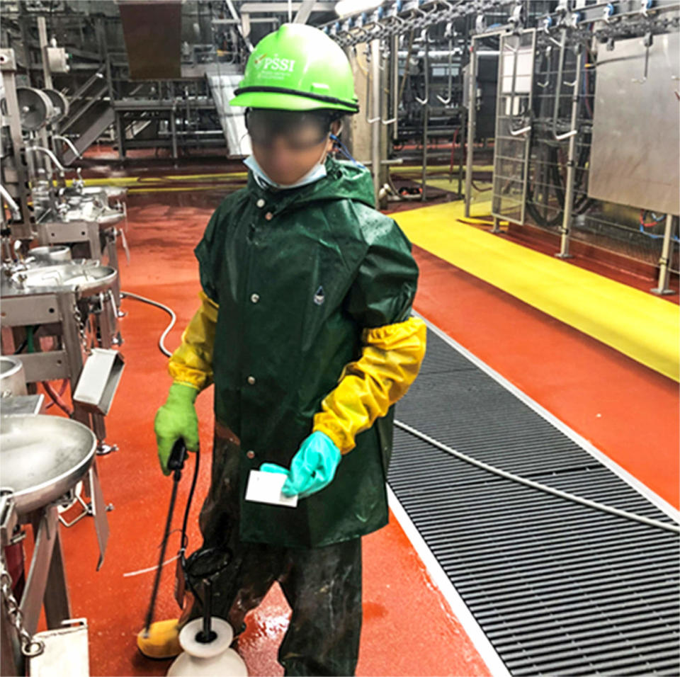 A Department of Labor investigator photographed a child who worked for Packers Sanitation Services Inc. (PSSI) cleaning a slaughterhouse in Grand Island, Nebraska. The subject has been blurred by the source. (U.S. Department of Labor)