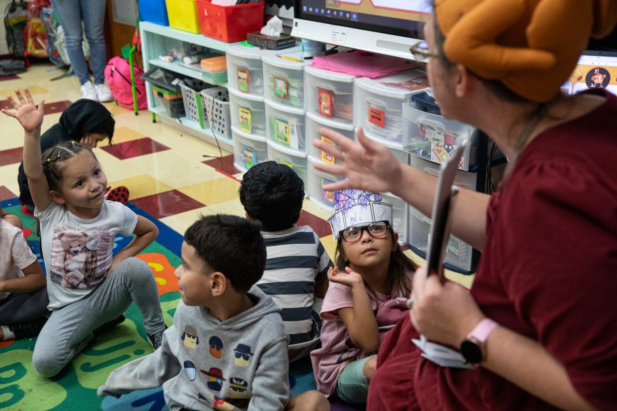 Kindergarten teacher Sally Attwood asks students what they can eat for Thanksgiving aside from turkey at Sam Houston Elementary on Thursday, Nov. 16, 2023, in Corpus Christi, Texas. Jada Delagarza raises her hand and offers pizza as an alternative.