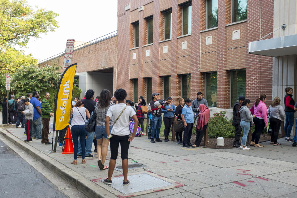 WASHINGTON, D.C. - AUGUST 28: People stand in line, some since 5am, to recharge their SNAP benefits or apply for new benefits at the Taylor Street Service Center on August 28, 2017 in Washington, D.C. (Jason Andrew for The Washington Post via Getty Images)