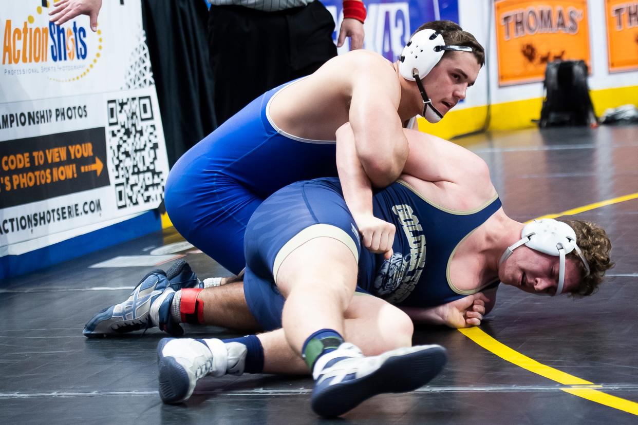 Quakertown's Calvin Lachman (left) wrestles in a 285-pound first round bout at the PIAA Class 3A Wrestling Championships at the Giant Center on March 7, 2024, in Hershey.