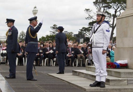 Prince Charles (2nd L) salutes after laying a wreath at the Auckland War Memorial on November 11. The prince will celebrate his 64th birthday in the capital on Wednesday at a gathering at Government House with people who were also born on November 14