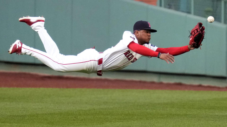 Boston Red Sox center fielder Ceddanne Rafaela dives but can't make the play on a two-RBI triple by Tampa Bay Rays' Amed Rosario during the first inning of a baseball game at Fenway Park, Monday, May 13, 2024, in Boston. (AP Photo/Charles Krupa)