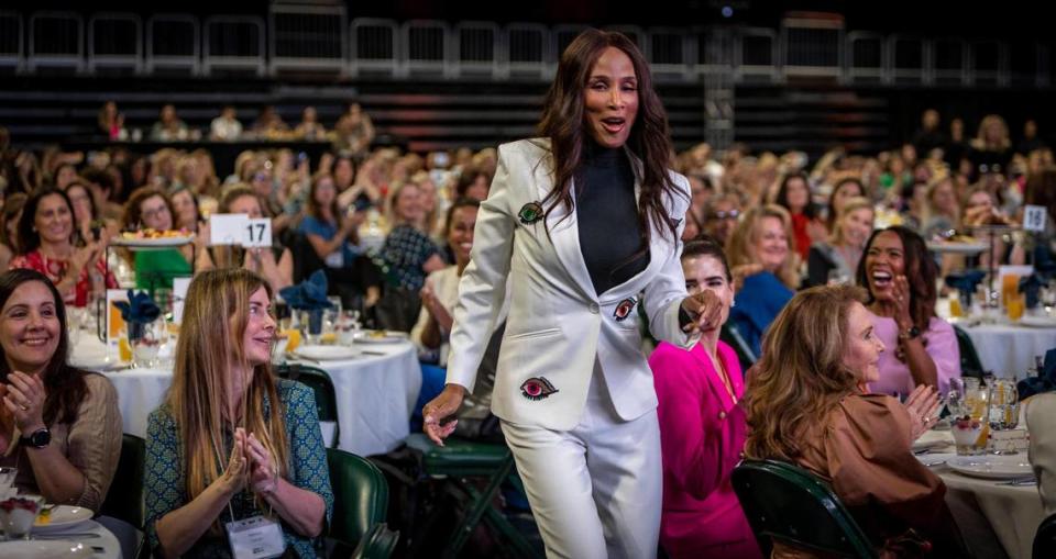 Beverly Johnson dances her way to the stage during the United Way Miami’s Women United breakfast Wednesday at University of Miami’s Watsco Center.