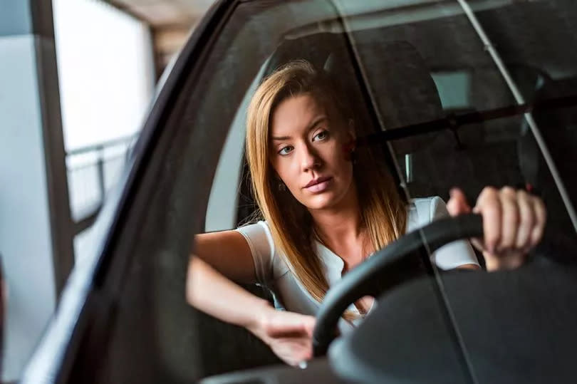 A woman driving around the city