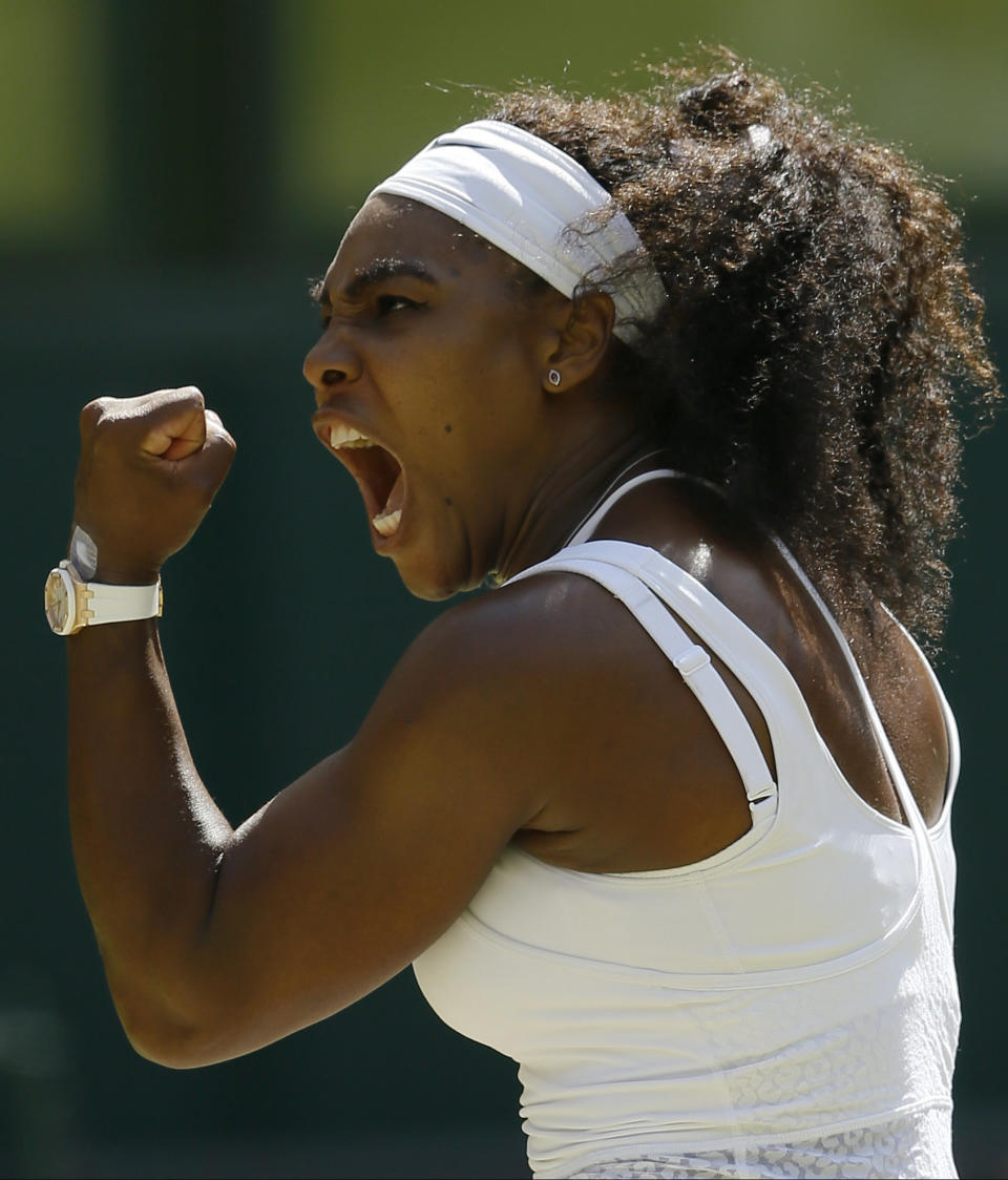 Serena Williams of the United States  celebrates winning a point against Garbine Muguruza of Spain, during the women's singles final at the All England Lawn Tennis Championships in Wimbledon, London, Saturday July 11, 2015. (AP Photo/Kirsty Wigglesworth)