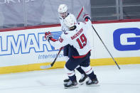 Washington Capitals left wing Jakub Vrana (13) celebrates after scoring a goal with center Nicklas Backstrom (19) during the third period of an NHL hockey game against the New Jersey Devils, Saturday, Feb. 27, 2021, in Newark, N.J. (AP Photo/Mary Altaffer)