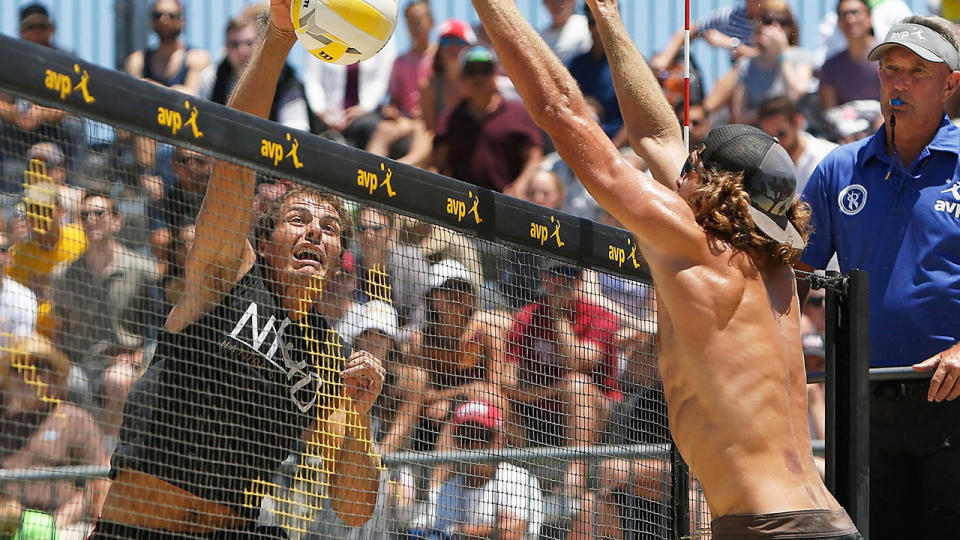 Eric Zaun spikes the ball past Jeremy Casebeer during day 3 of the AVP San Francisco Open at Pier 30-32 on July 8, 2017 in San Francisco, California. (Photo Lachlan Cunningham/Getty Images)