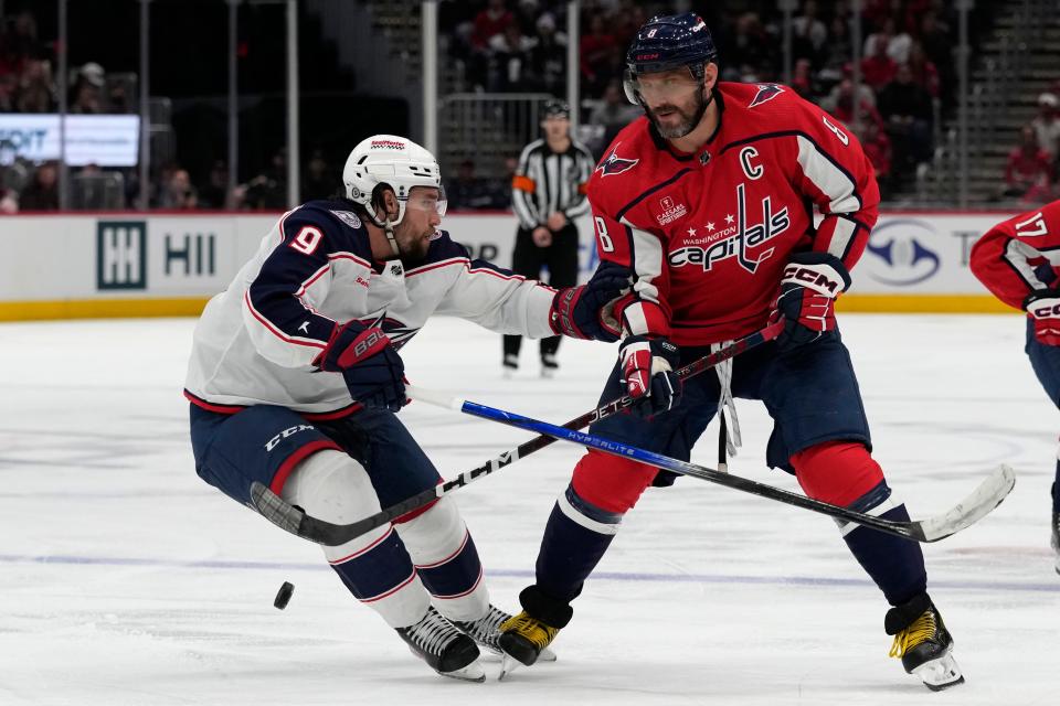 Washington Capitals left wing Alex Ovechkin (8) moves the puck past Columbus Blue Jackets defenseman Ivan Provorov (9) during the third period of an NHL hockey game in Washington, Saturday, Nov. 18, 2023. The Capitals beat the Blue Jackets, 4-3. (AP Photo/Susan Walsh)