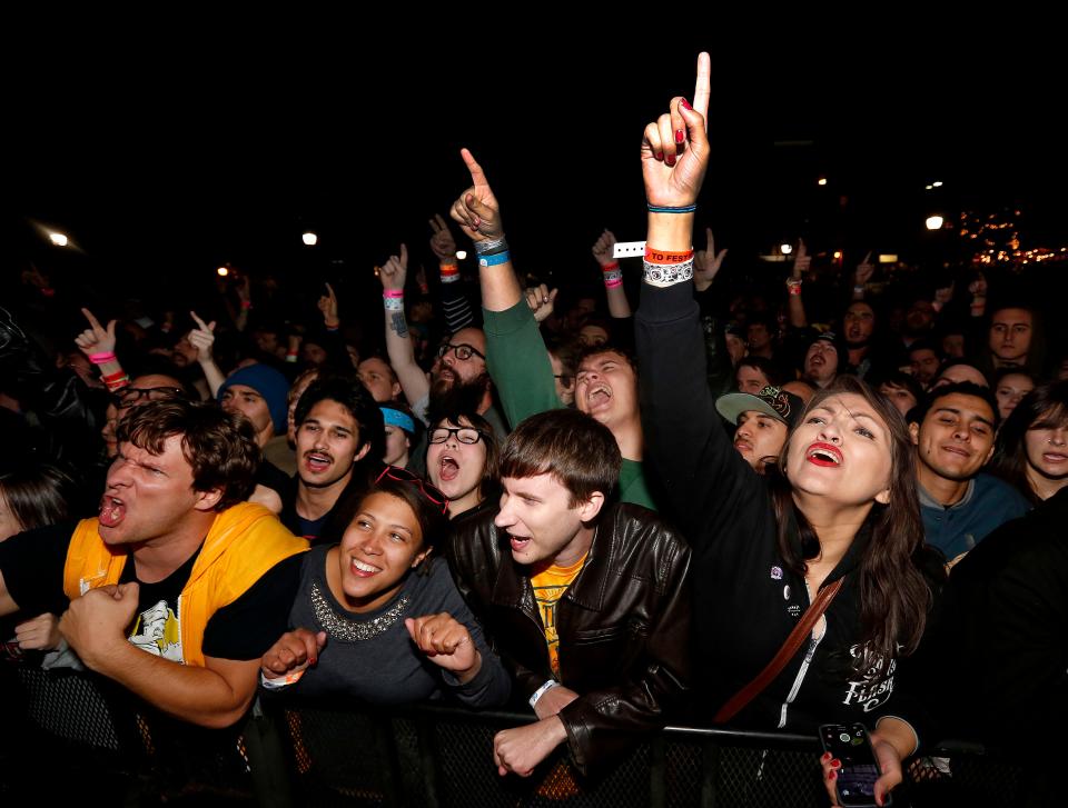 Fans sing along with Less Than Jake on the second day of Fest on Saturday, Nov. 1, 2014, in Gainesville, Fla.