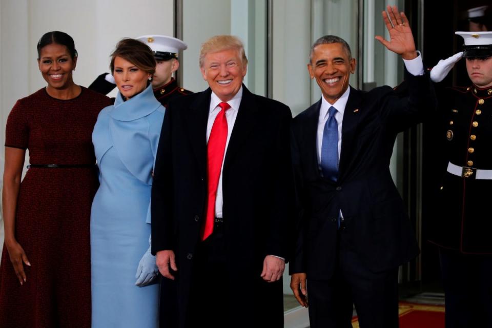 U.S. President Barack Obama (R) and first lady Michelle Obama (L) greet U.S. President-elect Donald Trump and his wife Melania for tea before the inauguration at the White House in Washington, U.S. January 20, 2017. REUTERS/Jonathan Ernst