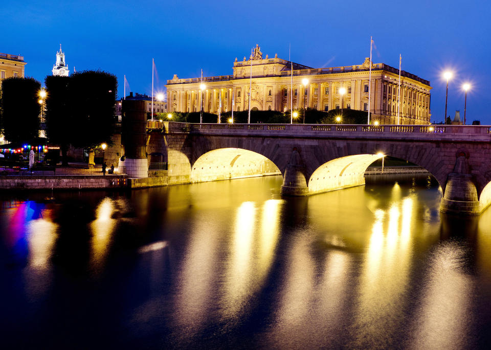 In this Aug. 30, 2018 photo the front side of the Swedish parliament is illuminated in Stockholm, Sweden, Thursday. (AP Photo/Michael Probst)