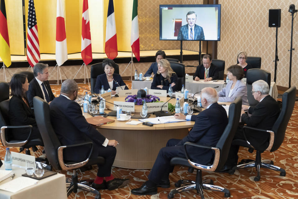 Ukraine's Foreign Minister Dmytro Kuleba is seen on a monitor as Germany's Foreign Minister Annalena Baerbock, clockwise from left to right, U.S. Secretary of State Antony Blinken, Japan's Foreign Minister Yoko Kamikawa, Canada's Foreign Minister Melanie Joly, France's Foreign Minister Catherine Colonna, Italy's Foreign Minister Antonio Tajani, High Representative of the European Union for Foreign Affairs and Security Policy Josep Borrell and Britain's Foreign Secretary James Cleverly attend an outreach session during the Group of 7 Foreign Ministers meetings at the Iikura Guest House in Tokyo Wednesday, Nov. 8, 2023. (Tomohiro Ohsumi/Pool Photo via AP)