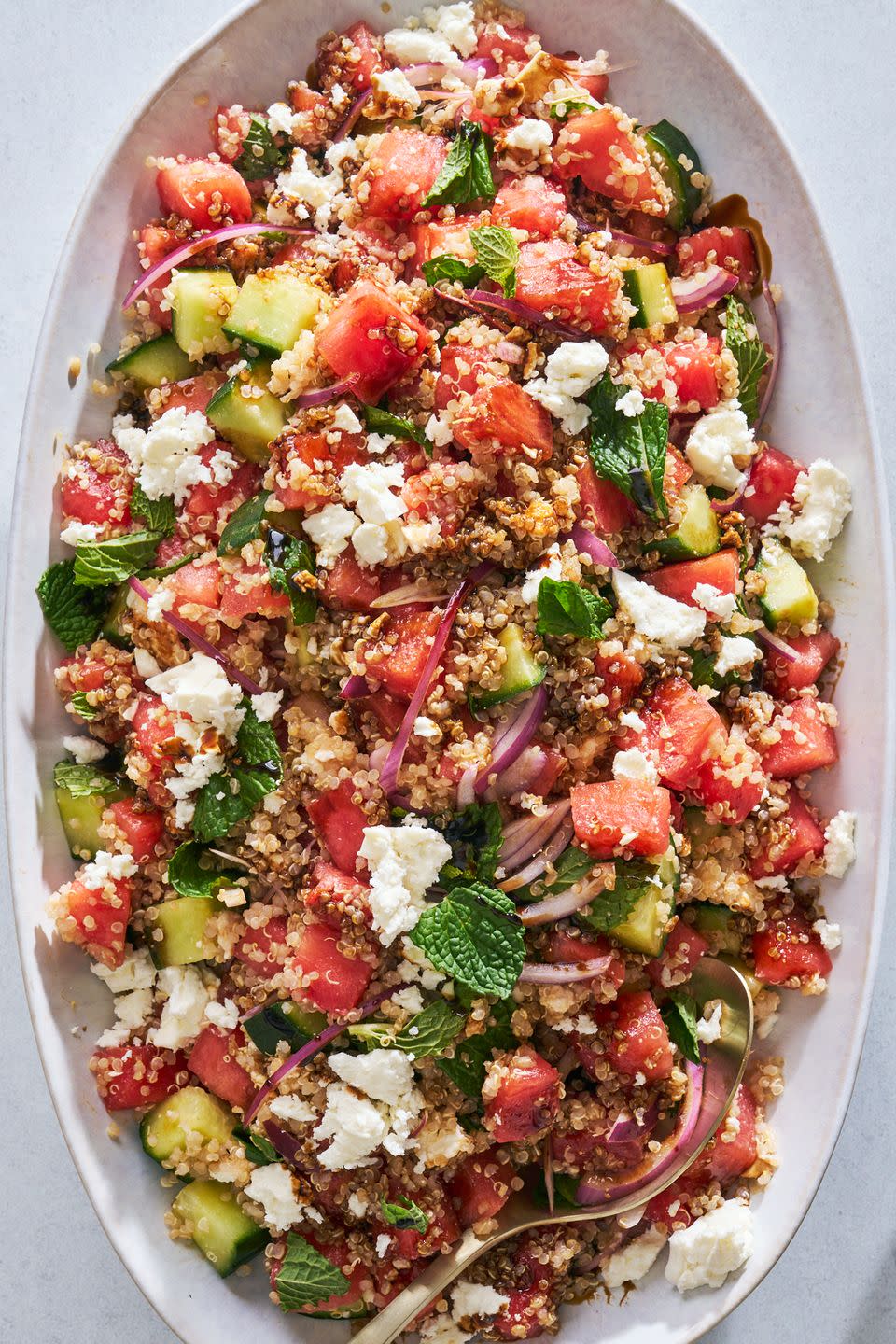 watermelon quinoa salad garnished with feta and mint