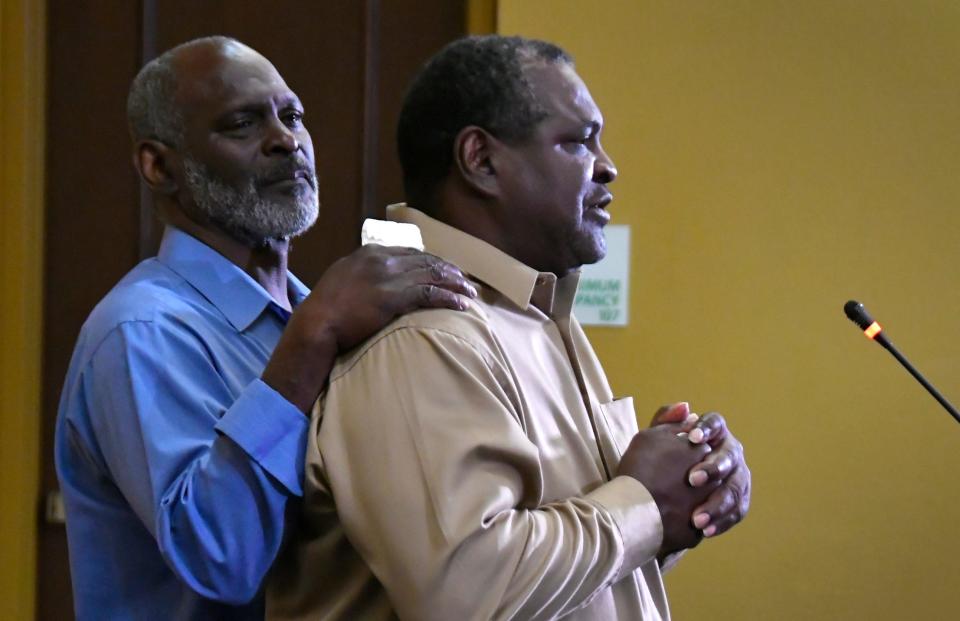 Crosley Green, in blue, comforts his brother O' Connor Green, as he speaks about the case. A press conference was held at the Holiday Inn in Titusville on February 27 after Crosley's lawyers learned the U.S. Supreme Court would not hear the case. Green has spent 32 years behind bars. He has fought for his innocence since being convicted of a murder in 1989.
(Photo: TIM SHORTT/ FLORIDA TODAY)