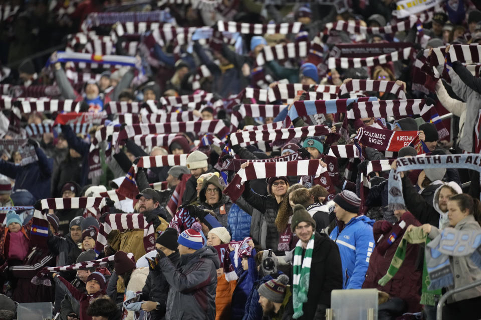 Fans welcome the Colorado Rapids to the pitch for an MLS soccer match against Sporting Kansas City on Saturday, March 4, 2023, in Commerce City, Colo. (AP Photo/David Zalubowski)