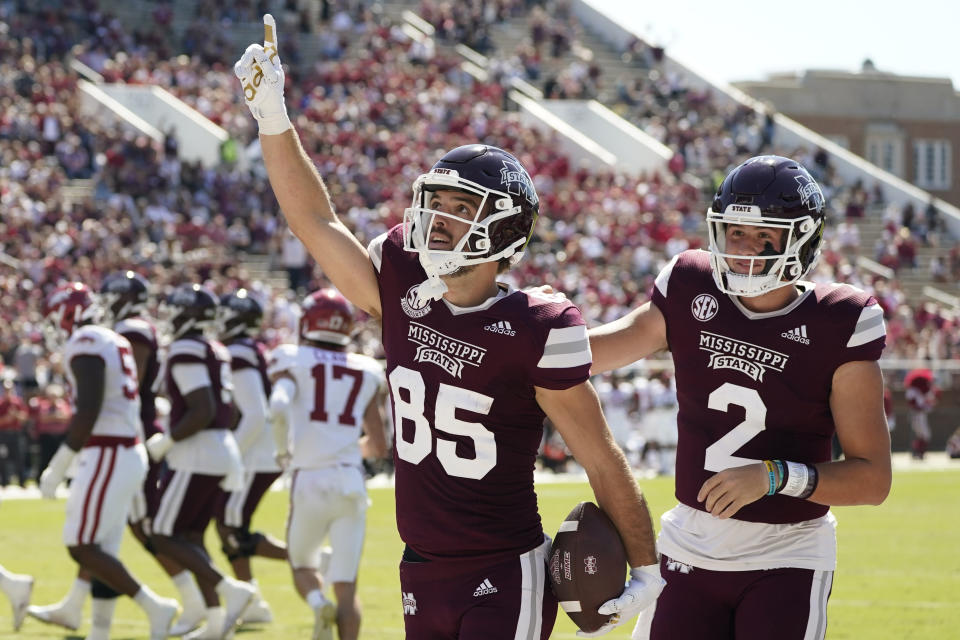 Mississippi State wide receiver Austin Williams (85) celebrates his 10-yard pass reception from quarterback Will Rogers (2) during the first half of an NCAA college football game against Arkansas in Starkville, Miss., Saturday, Oct. 8, 2022. (AP Photo/Rogelio V. Solis)