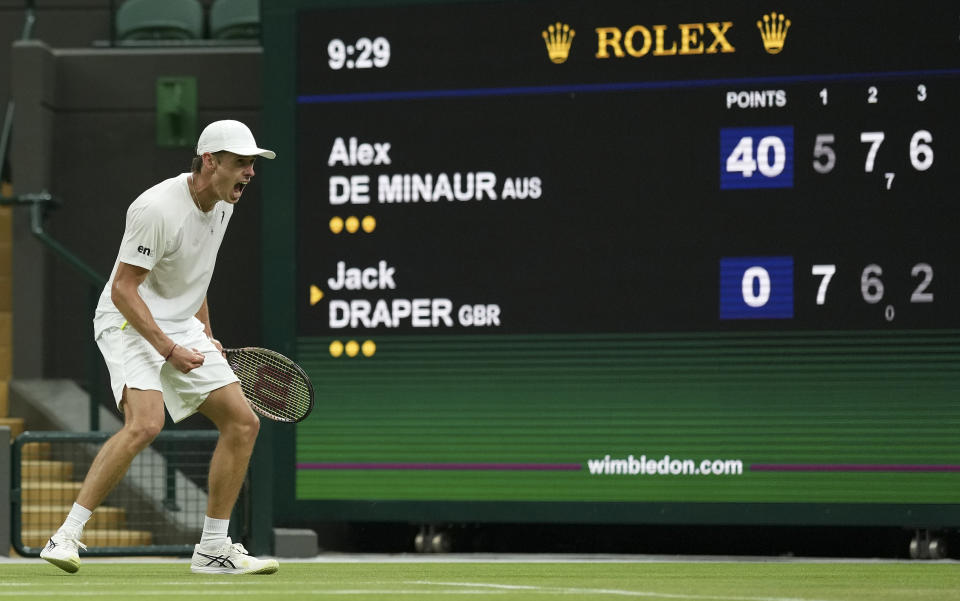 Australia's Alex De Minaur celebrates winning a point against Britain's Jack Draper in a second round men's singles match on day four of the Wimbledon tennis championships in London, Thursday, June 30, 2022. (AP Photo/Alberto Pezzali)