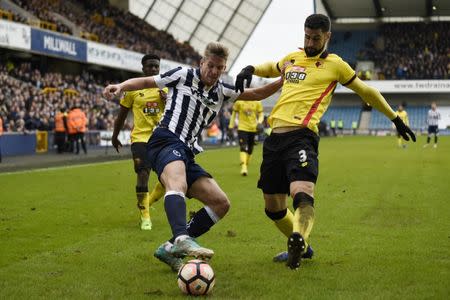 Britain Football Soccer - Millwall v Watford - FA Cup Fourth Round - The New Den - 29/1/17 Millwall's Steve Morison in action with Watford's Miguel Britos Action Images via Reuters / Tony O'Brien Livepic EDITORIAL USE ONLY. No use with unauthorized audio, video, data, fixture lists, club/league logos or "live" services. Online in-match use limited to 45 images, no video emulation. No use in betting, games or single club/league/player publications. Please contact your account representative for further details.