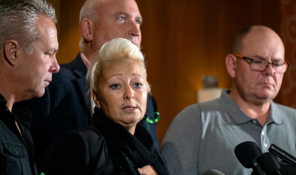 Charlotte Charles, mother of Harry Dunn, who died after his motorbike was involved in an August 2019 accident in Britain, speaks at news conference; she is joined by Dunn's father Tim Dunn, far right, and other family members and supporters.