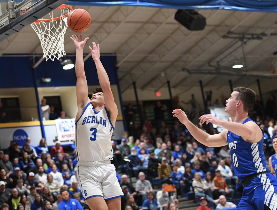 Berlin Brothersvalley's Craig Jarvis beats Conemaugh Valley defender Noah Miller, right, to the basket in a PIAA Class 1A first-round boys basketball contest, March 8, at Pitt-Johnstown.