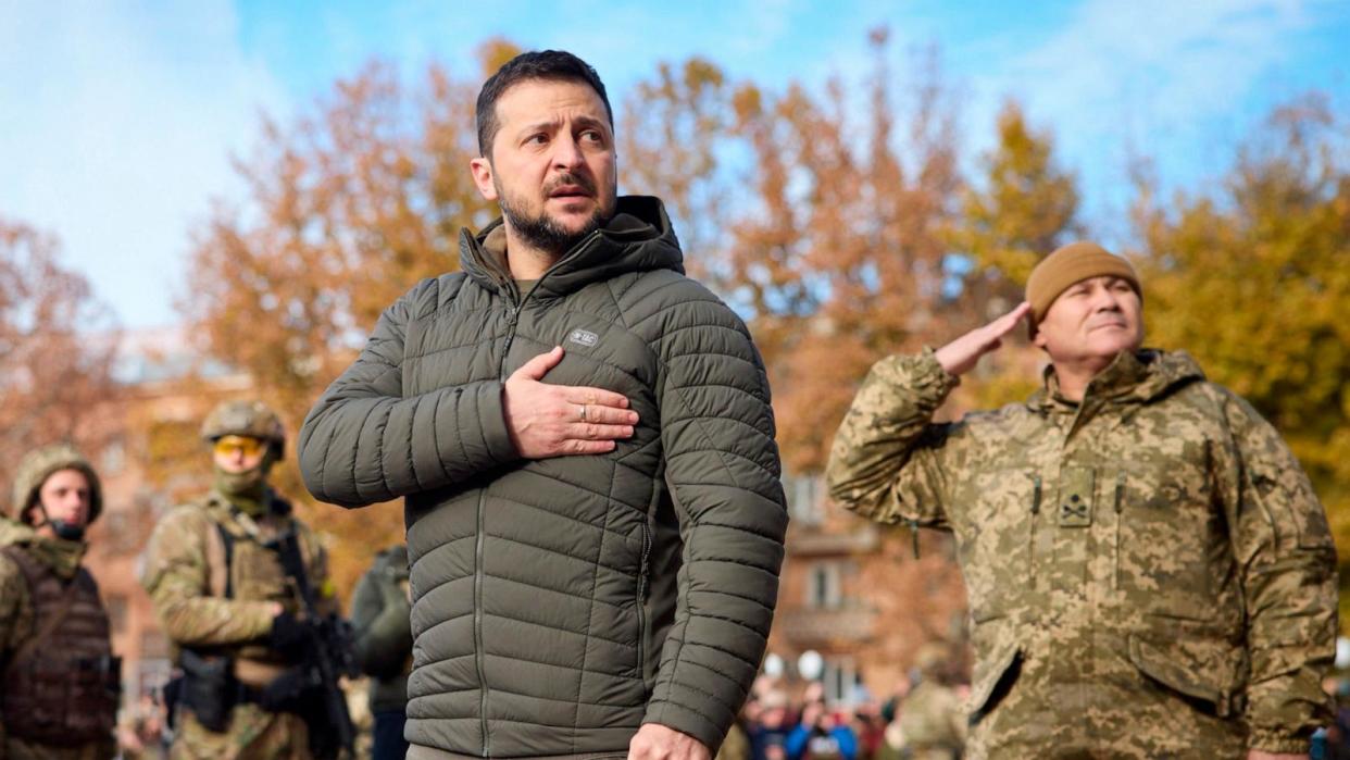 PHOTO: In this photo provided by the Ukrainian Presidential Press Office, Ukrainian President Volodymyr Zelenskyy listens to the national anthem during his visit to Kherson, Ukraine, Nov. 14, 2022. (Ukrainian Presidential Press Office via AP)