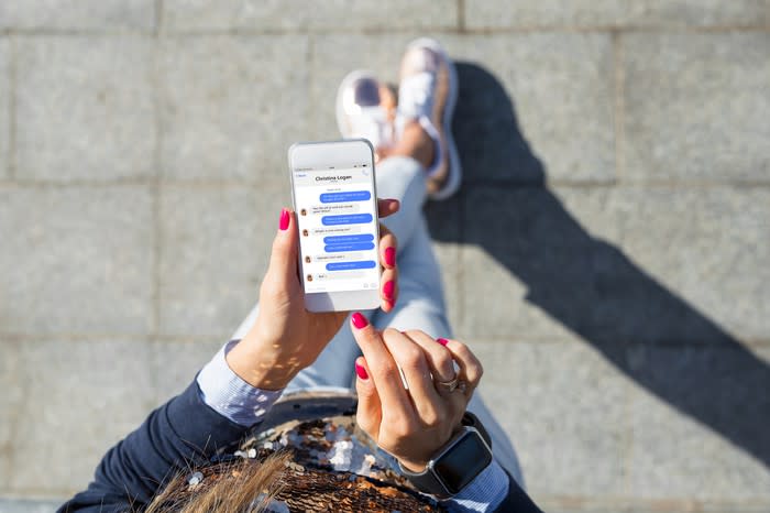 A smartphone user chats on a smartphone.