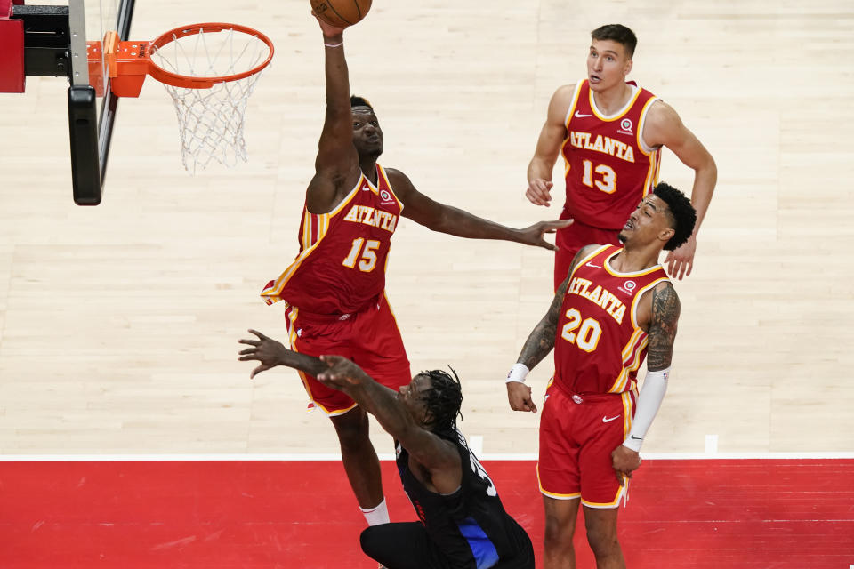 Atlanta Hawks' Clint Capela (15) rejects New York Knicks' Julius Randle's shot (30) during the second half in Game 3 of an NBA basketball first-round playoff series Friday, May 28, 2021, in Atlanta. (AP Photo/Brynn Anderson)