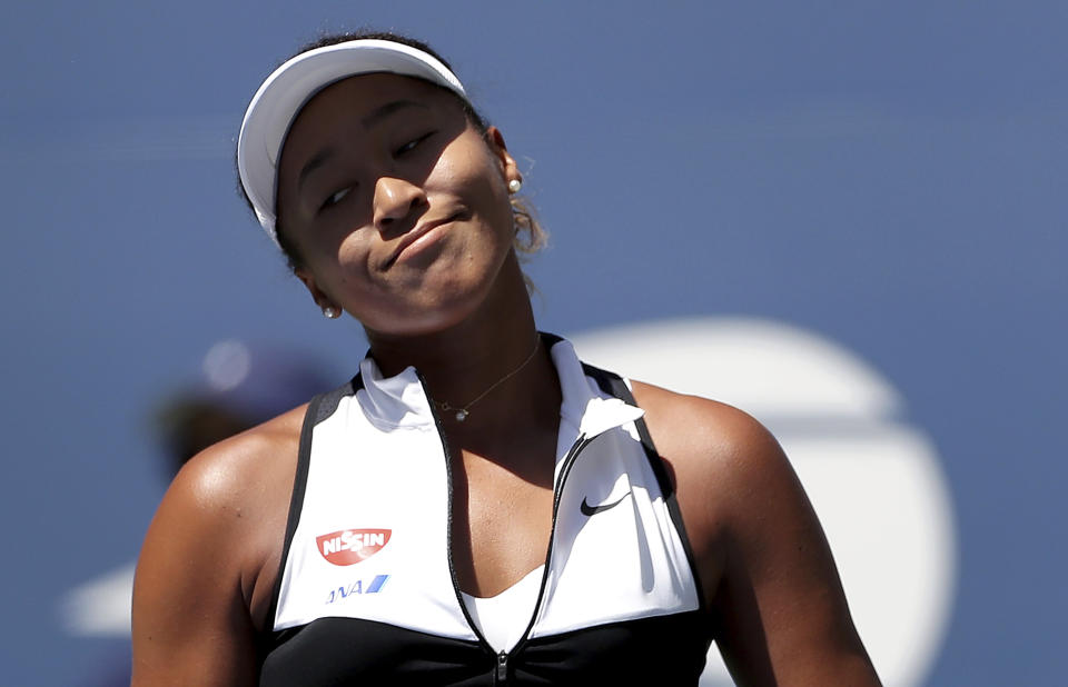 Naomi Osaka, of Japan, reacts after losing a point to Magda Linette, of Poland, during the second round of the US Open tennis championships Thursday, Aug. 29, 2019, in New York. (AP Photo/Eduardo Munoz Alvarez)