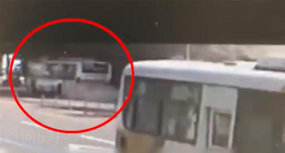 The security footage shows the bus seconds before it is crushed by the falling building. Source: Weibo