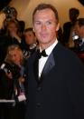 <p>Michael Keaton flashed a smile as he arrived on the red carpet of the Cannes Film Festival, sporting his signature short brown hair in 2002. </p>