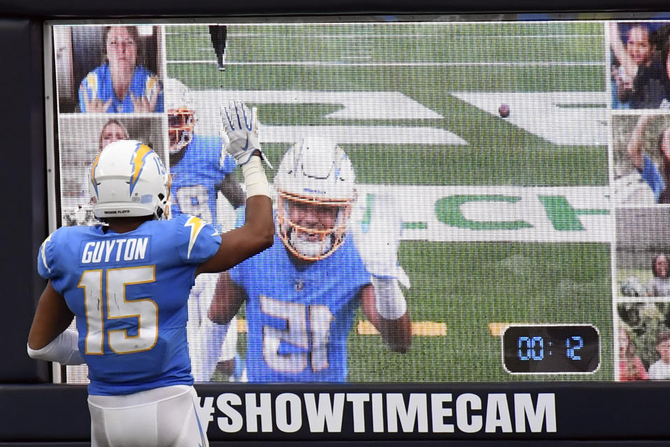 Los Angeles Chargers wide receiver Jalen Guyton waves at a screen after making a touchdown catch against the Jacksonville Jaguars during the second half of an NFL football game Sunday, Oct. 25, 2020, in Inglewood, Calif. (AP Photo/Kyusung Gong)