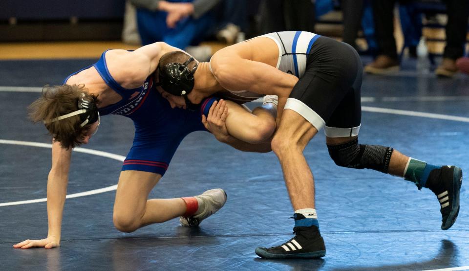 Quakertown's Mason Ziegler against Neshaminy's Nate Pokalsky in the 121lbs class at the 2024 PIAA District One East Class 3A wrestling tournament in Quakertown on Saturday, Feb. 24, 2024.