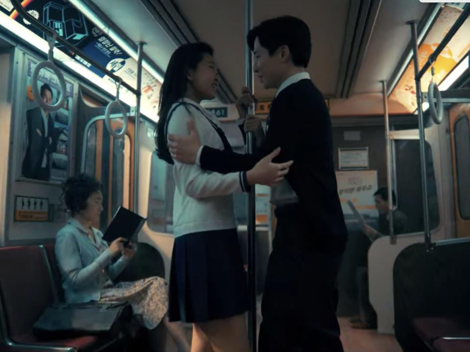 Two schoolchildren on a train in Seoul in season three of "The Umbrella Academy."