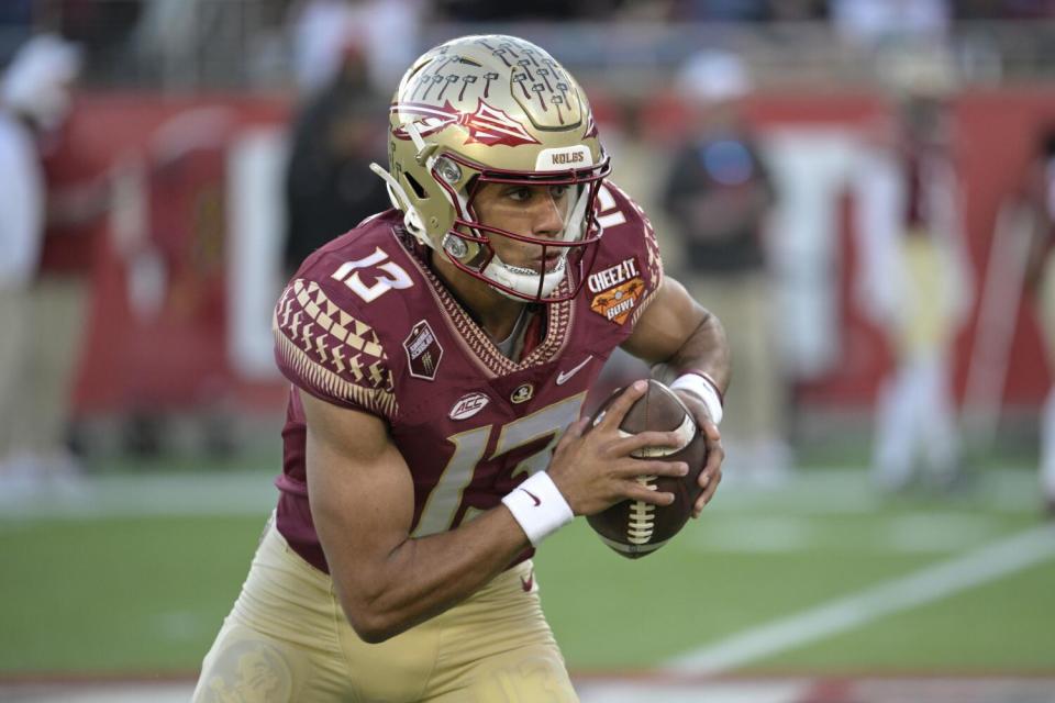 Florida State quarterback Jordan Travis warms up before playing Oklahoma in the Cheez-It Bowl on Dec. 29.