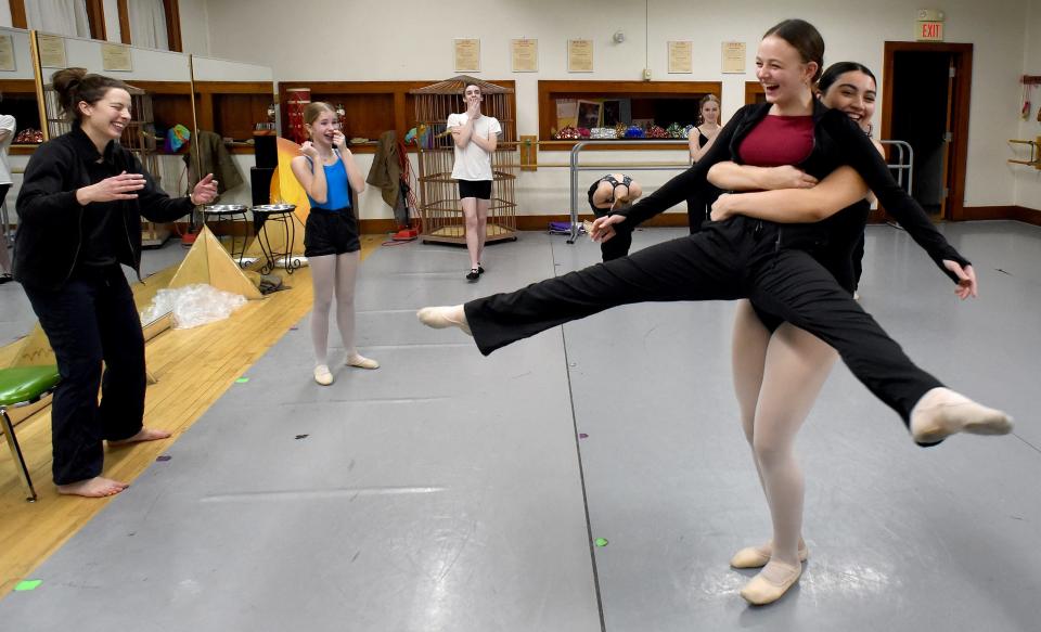 Big smiles and laughter as dancer Ashrah Kelly, 15, spins Ella Linster, 13, while others laugh and smile as well, instructor Isabelle Arnold (left), Hadley Himes, and Nathan Glover during the rehearsal of desert winds in the cave scene of Aladdin at River Raisin Ballet Company of the River Raisin Centre for the Arts in Monroe.