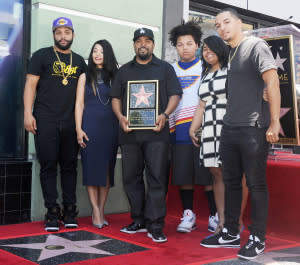 Ice Cube (center) and his wife and children