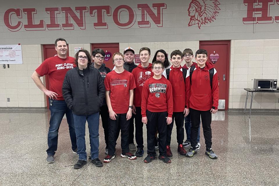 Port Clinton High School Robo-Skins Robotics team adviser Bobby Good is shown with team members Quinton Cook, left, Davis Toris, Alex Hill, Mason Short, Austin Leis, Ethan Leis, Xavier Good, Liam Coppeler, Abram Sandvick and Dean Coppeler.