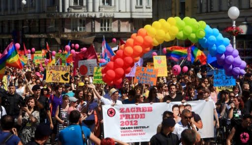 Participants display banners as they march during a Gay Pride parade in Zagreb. Some 2,000 people took part in a gay-rights march on Croatia's capital, calling on the government to boost the rights of same-sex couples in the largely conservative EU-bound country